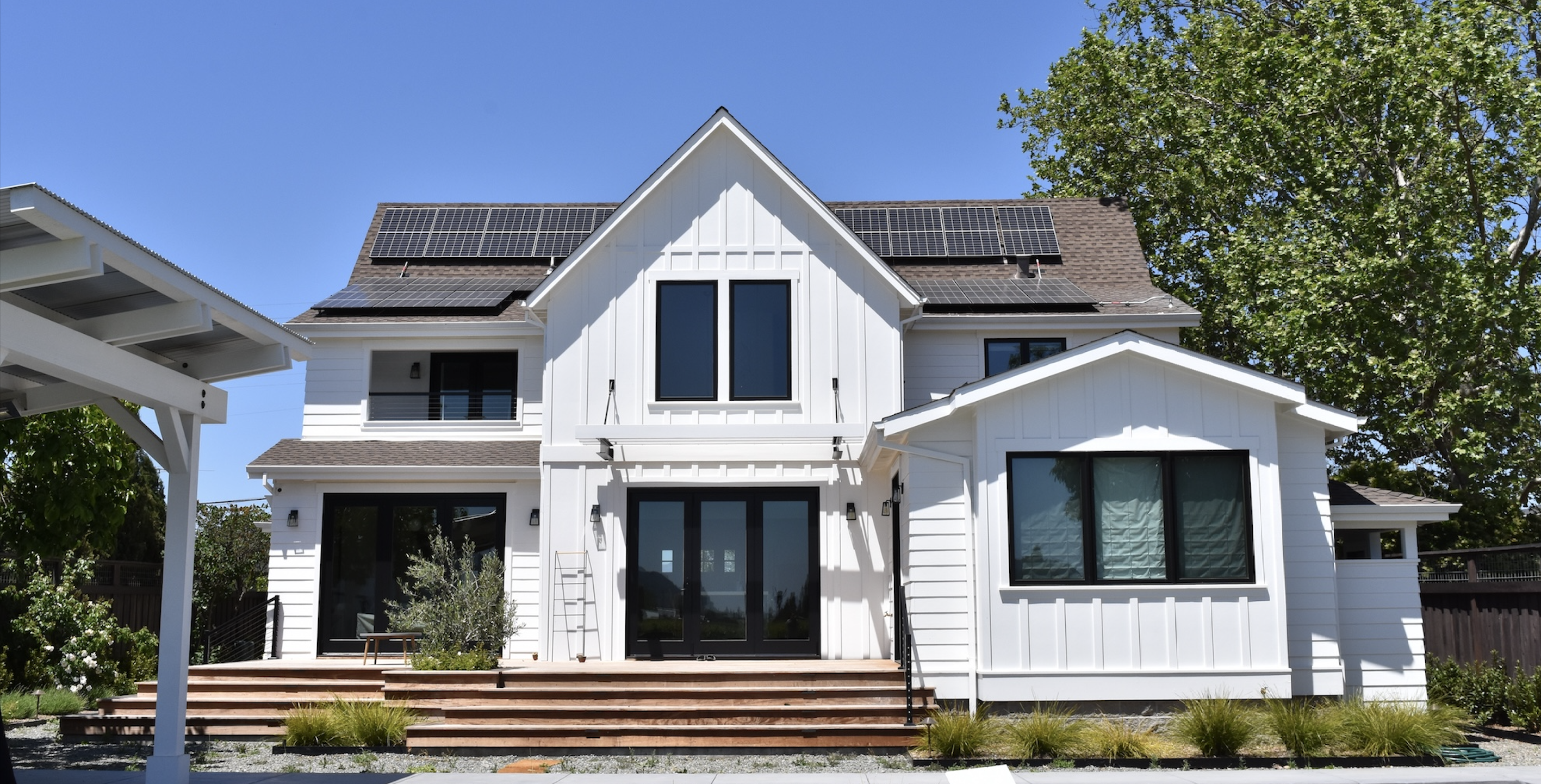 white house with rooftop solar panels